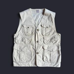 Filson vintage cream canvas utility vest with multiple pockets fits like a XL
